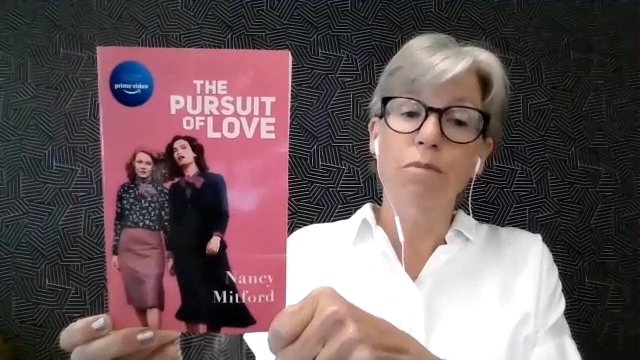 Sarah Bagby holds up a copy of The Pursuit of Love