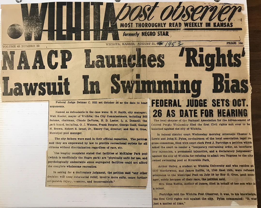 A newspaper clipping about the NAACP launching a lawsuit related to swimming pools